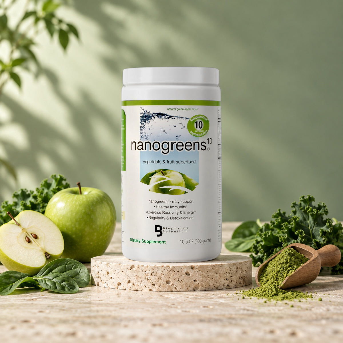 NanoGreens10 Green Apple superfood powder tub with fresh green apples, kale and a scoop of greens powder